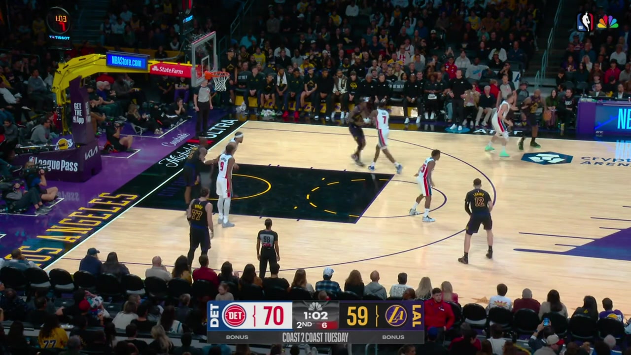 LeBron James with the side step the ball fake Duncan Robinson falls for the bait and jumps and LeBron drills the 3-pointer to beat the shot clock with a replay