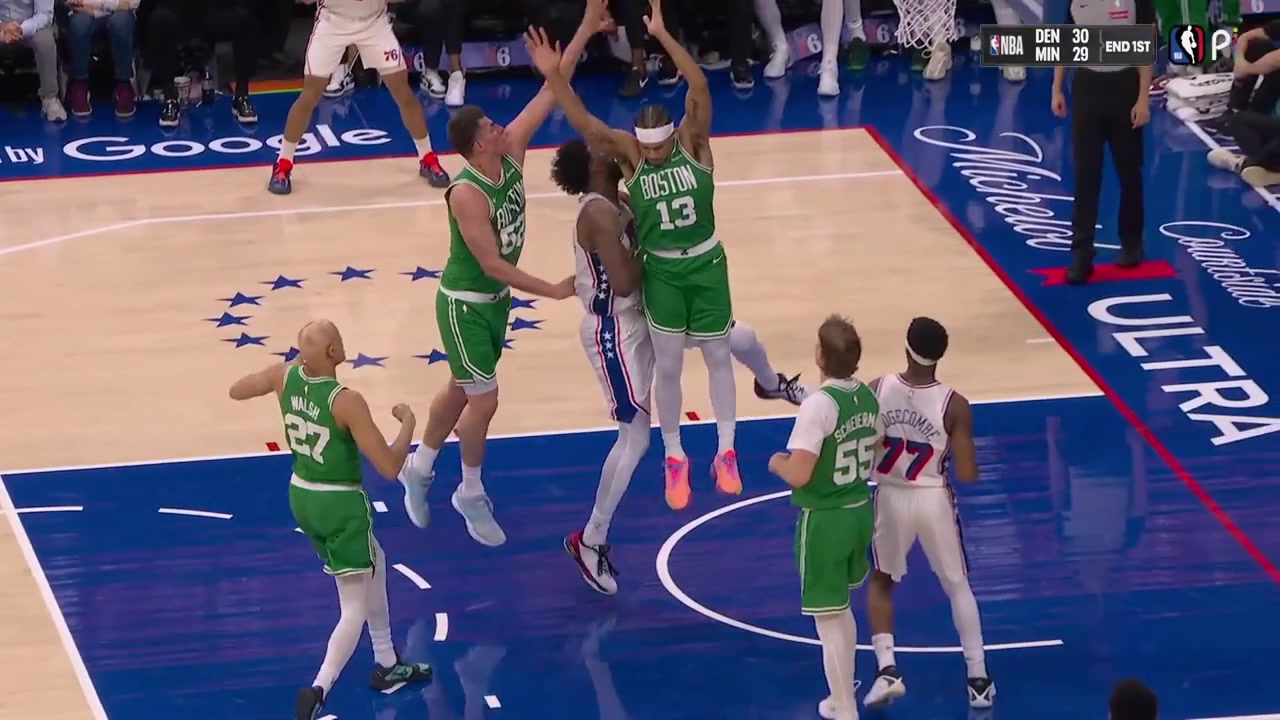A lot of sweat is sprayed off Joel Embiid after he gets fouled