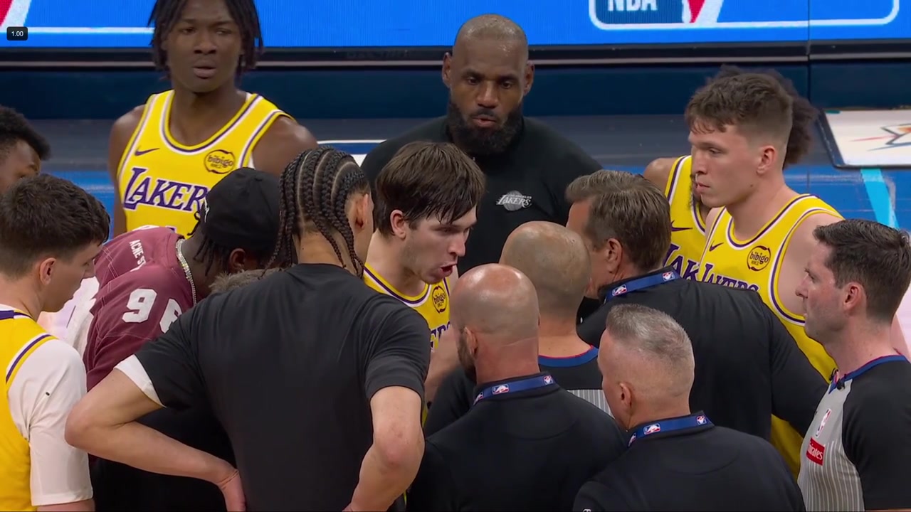 Lakers huddle at midcourt to speak with tonight's referee crew after the game