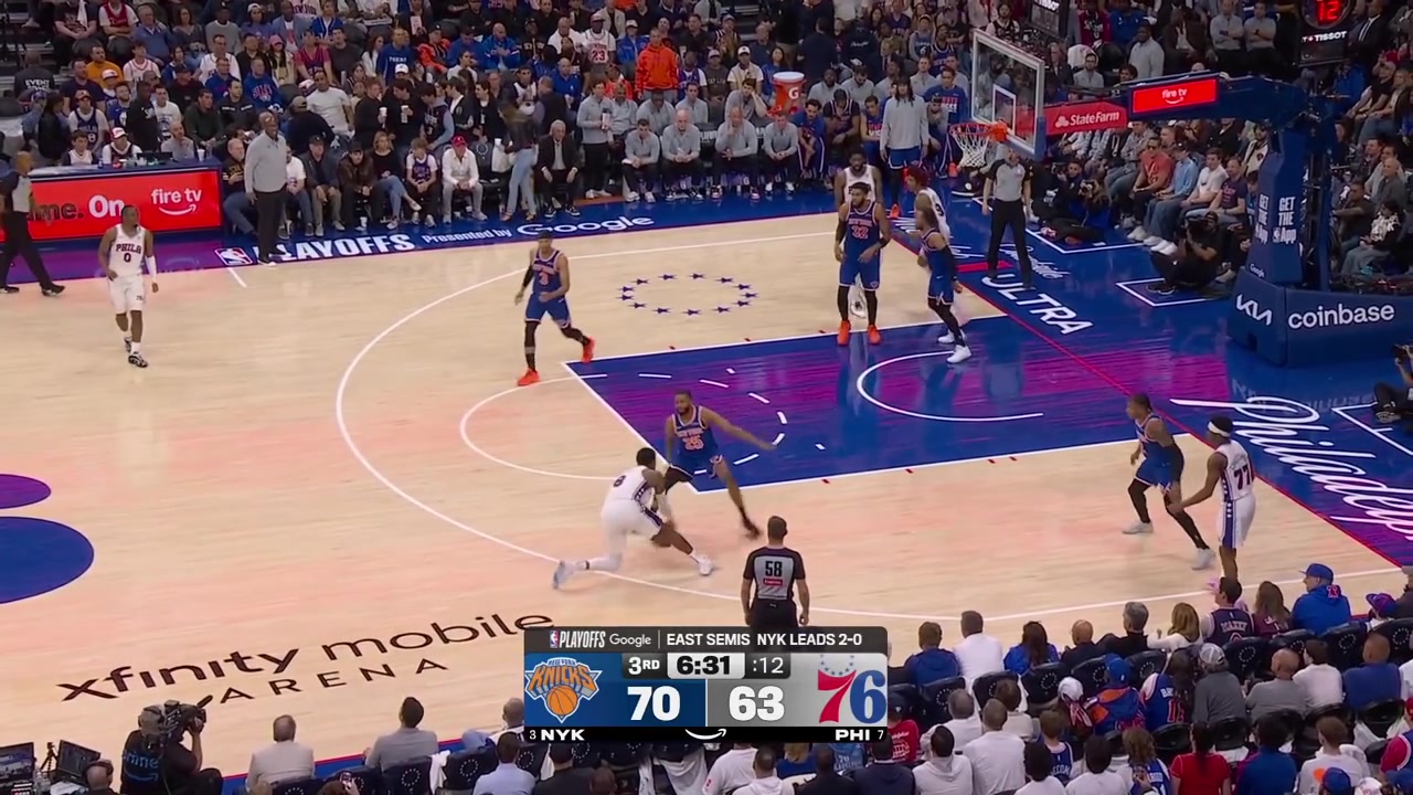 Karl-Anthony Towns gets called for the 4th foul as Joel Embiid falls to the floor
