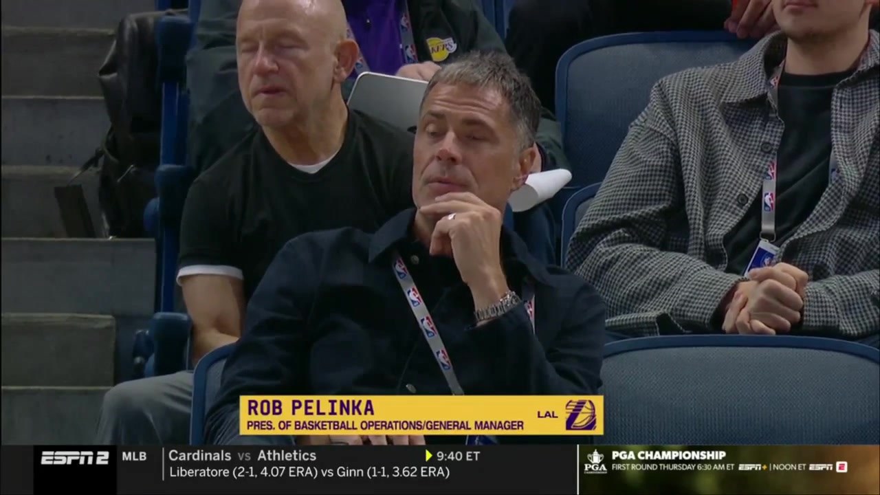 Thunder GM Sam Presti making some calls while watching the NBA Combine scrimmages
