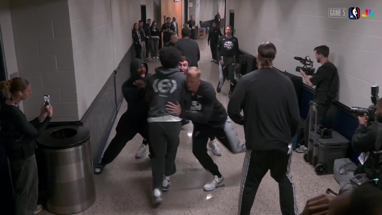 The Spurs players with their pre-game traditionTackling and dancing