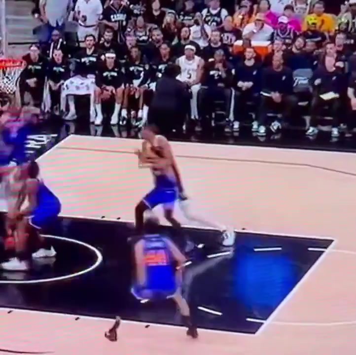 Victor Wembanyama grabs Jose Alvarado by the neck and tosses him