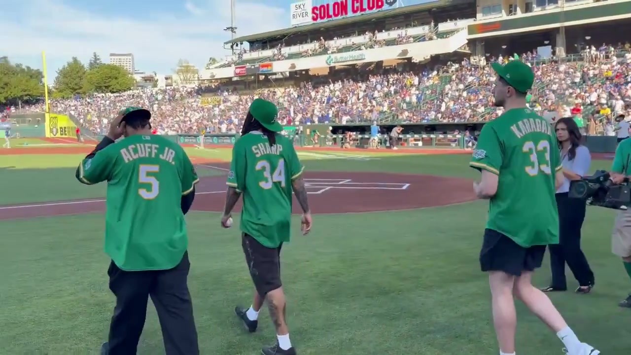 The Kings' latest draft picks Darius Acuff Jr Alex Karaban and Emanuel Sharp throw out the first pitch at the A's vs Dodgers game earlier today Sharp's throw unfortunately goes wild