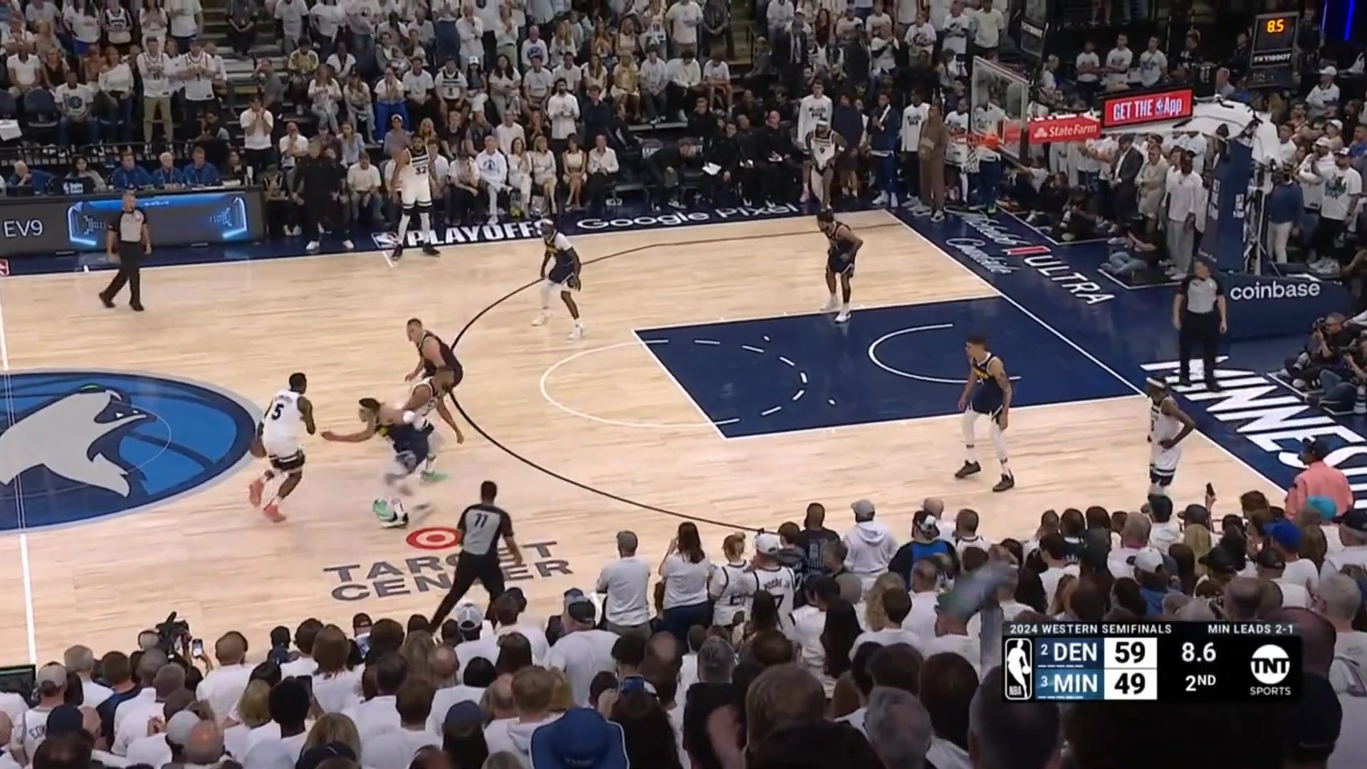 Jamal Murray hits the half court buzzer beater then stares down an ecstatic Kevin Harlan