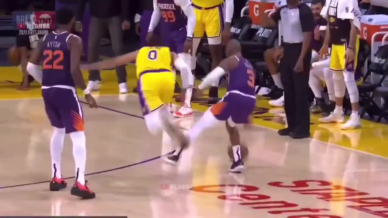 Chris Paul purposely extends his leg and shoves Kuzma in an attempt to trip him