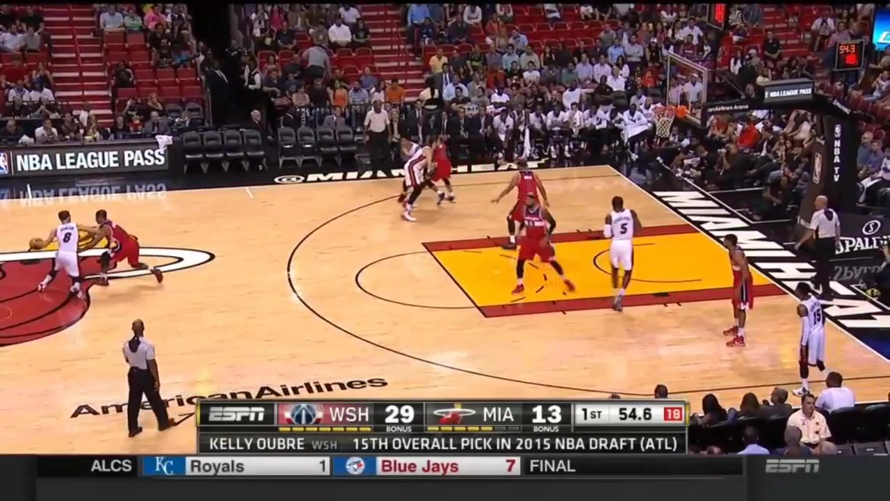 Miami's Tyler Johnson slams it in over Drew Gooden