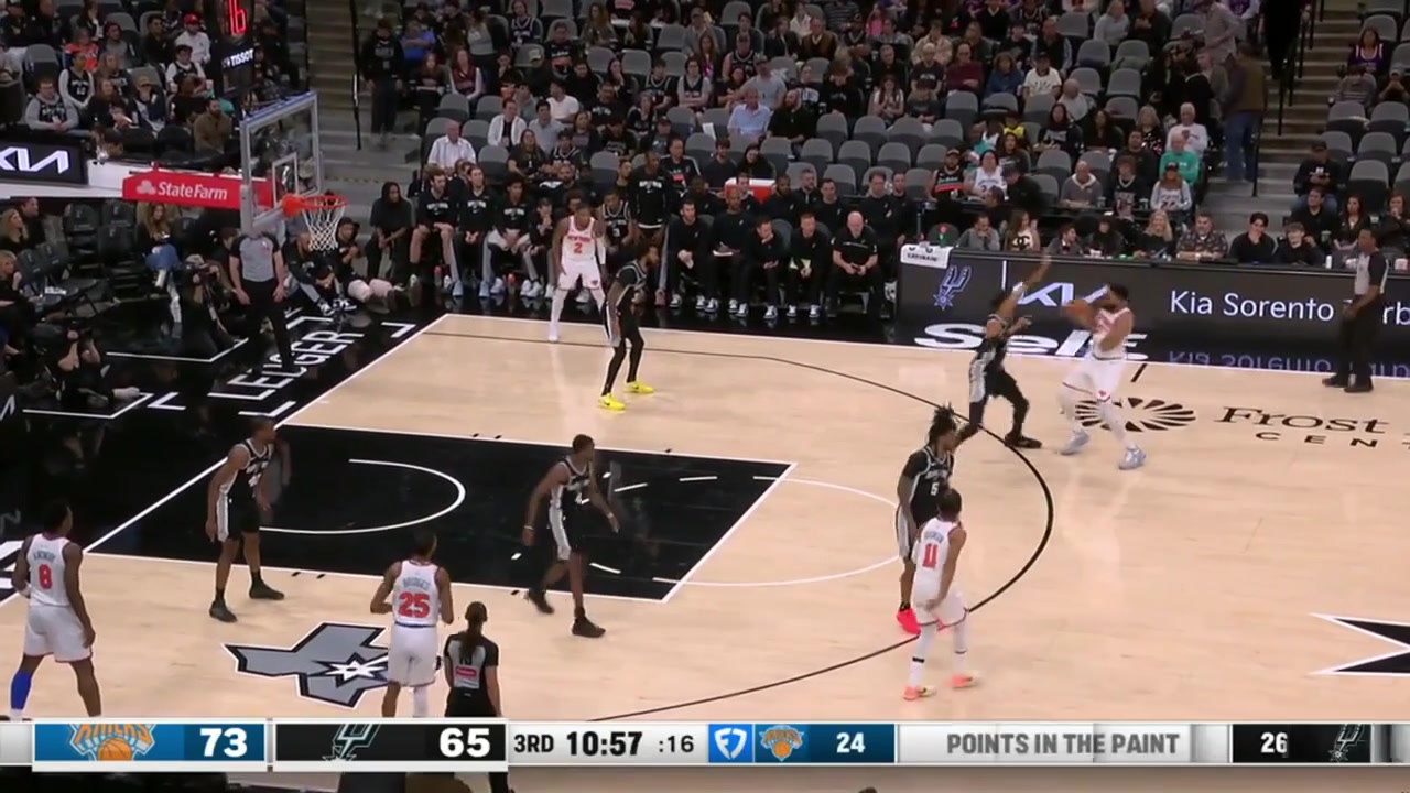 KAT navigates around Wemby for the and-1
