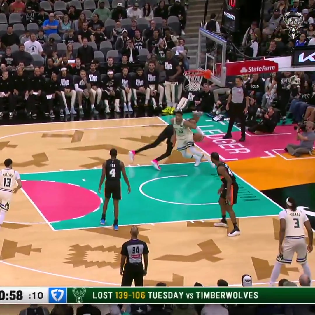 Giannis drives baseline around Wemby for the flush