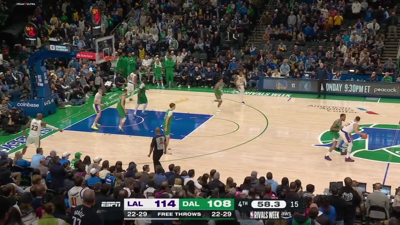 Luka Doncic drives between Mavericks defenders and scores He also draws the charge at the other end to secure the win for the Lakers