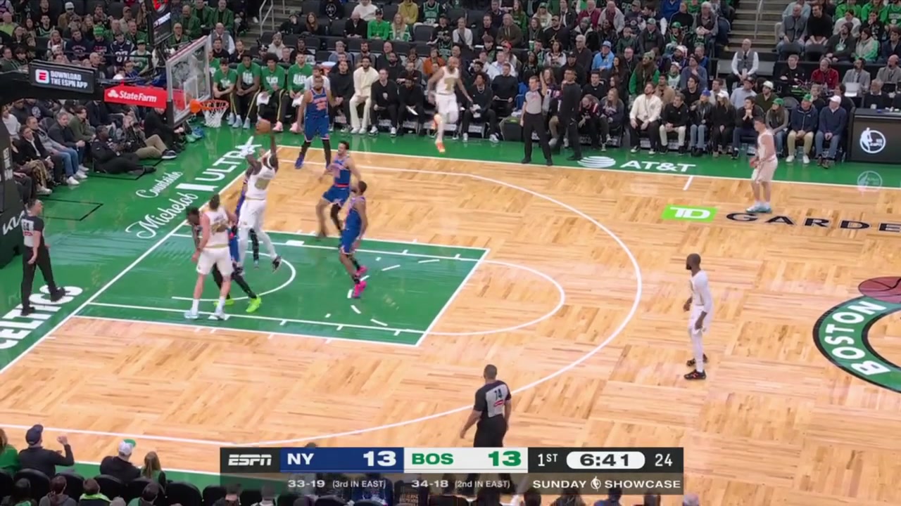 A chaotic sequence Neemias Queta grabs the offensive rebound but turns it over Landry Shamet intercepts gets bumped and Mikal Bridges dives for the loose ball flipping a pass from the floor to Karl-Anthony Towns for the easy bucket underneath