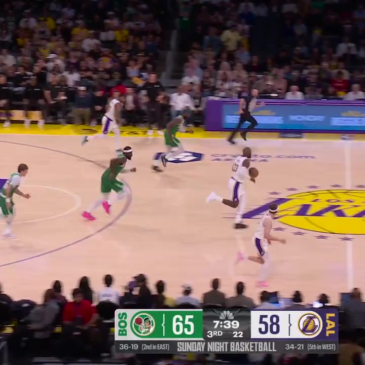 Neemias Queta soars to the sky to block LeBron James layup attempt