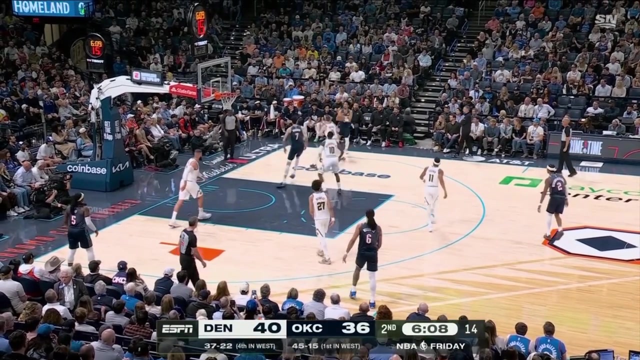 Jared McCain knocks down the step-back mid-range shot over Christian Braun