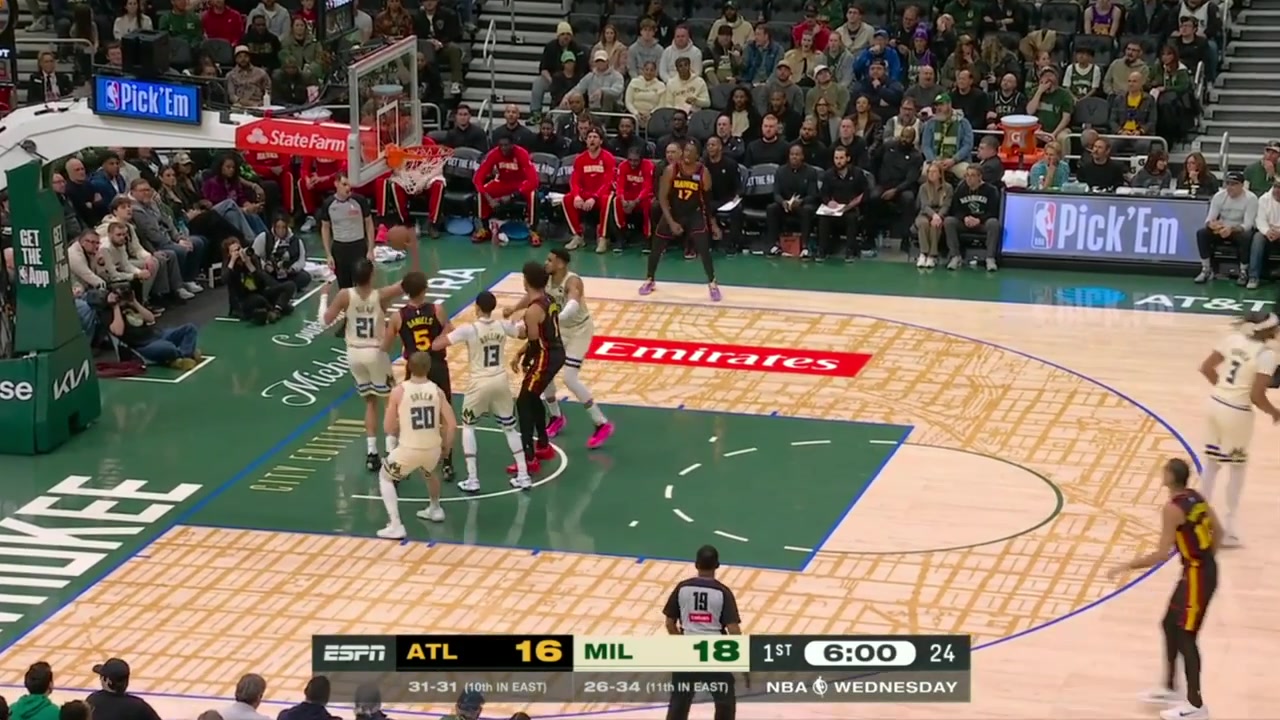 Giannis powers by a couple defenders for the dunk over Risacher