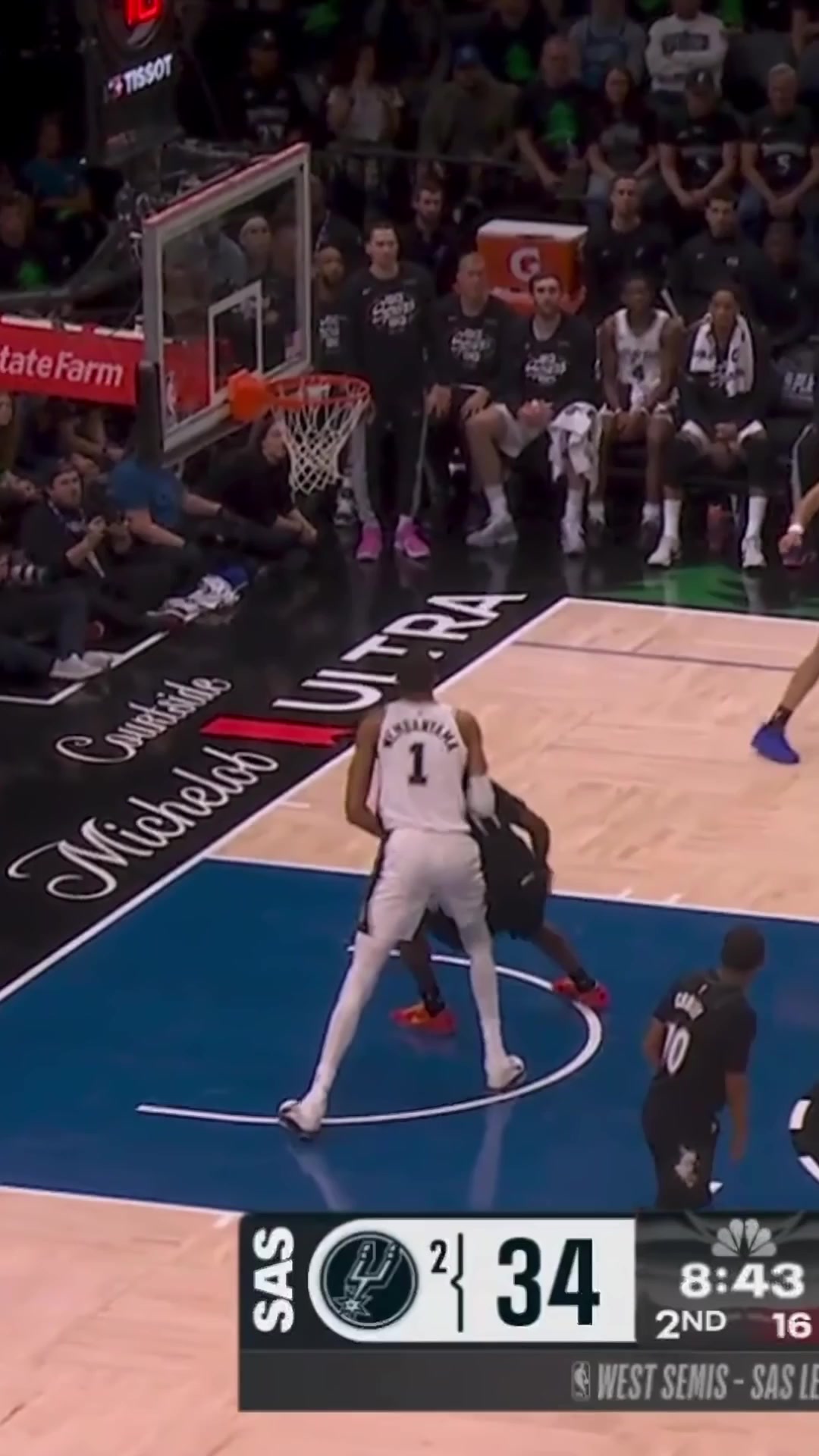 Naz Reid holding Wemby's leg on the rebound prior to the Flagrant 2 foul by Wemby