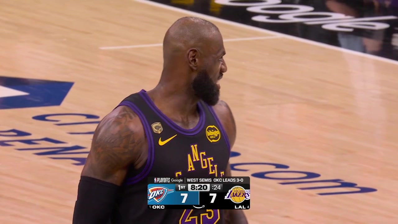 The camera focuses on Dillon Brooks who is laughing and watches LeBron James take his free throws right in front of him