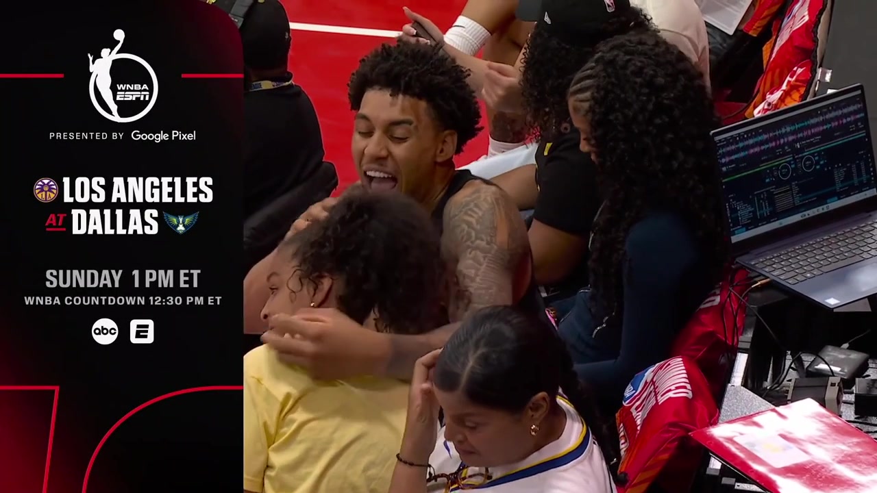 The cameraman focuses on someone singing while chokeholding a girl but she isn't enjoying it