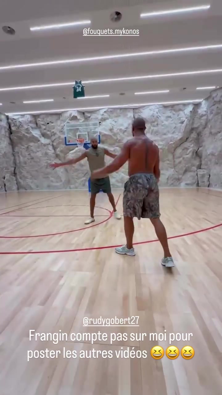 UFC Fighter Ciryl Gane shoots a step-back 3 over fellow Frenchman Rudy Gobert
