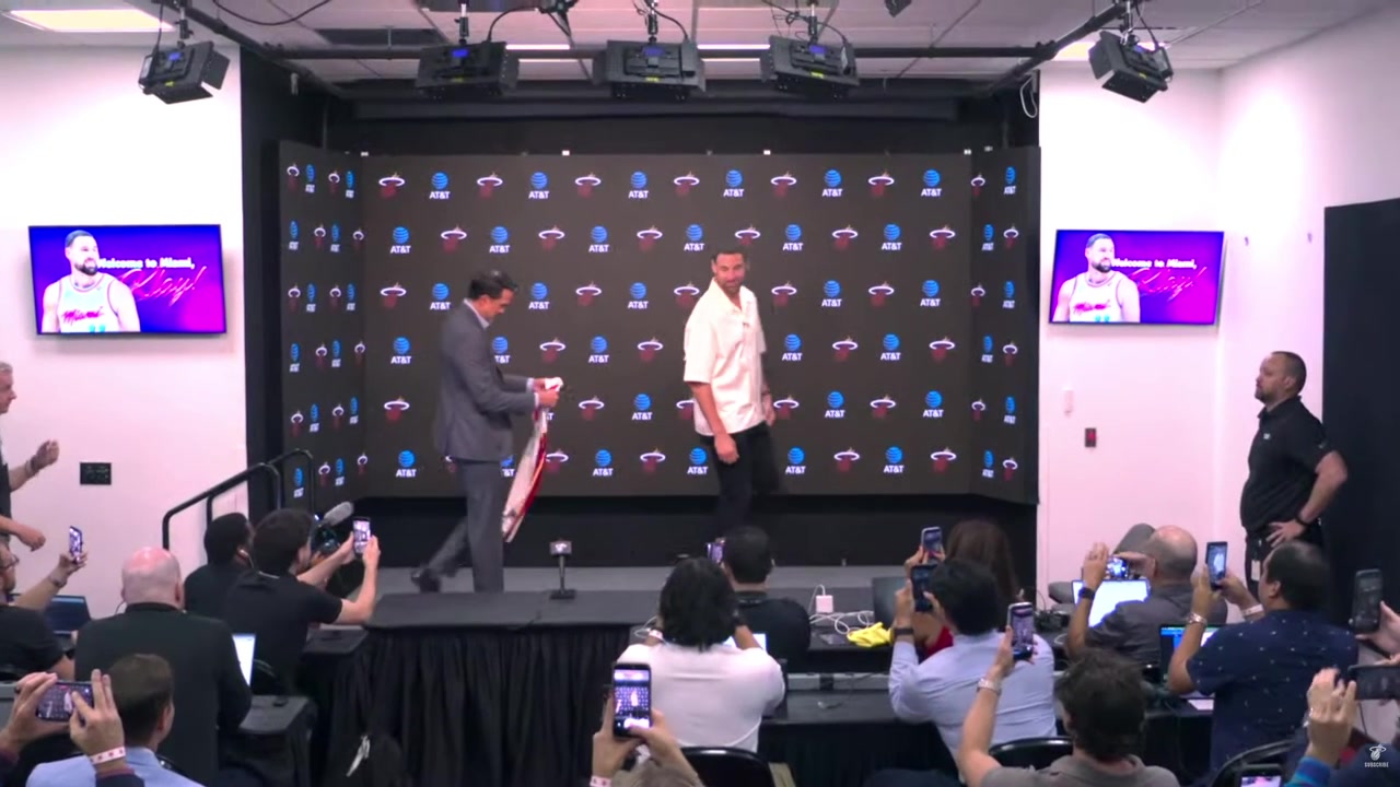 Erik Spoelstra and Klay Thompson take photos with Klay Thompson's new Miami Heat jersey