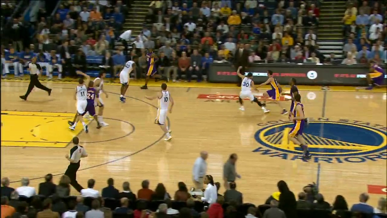 34 year old Kobe Bryant with a double-clutch reverse dunk over the baby Warriors