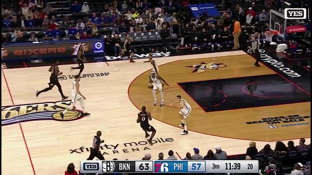 Joel Embiid goes down with a knee injury