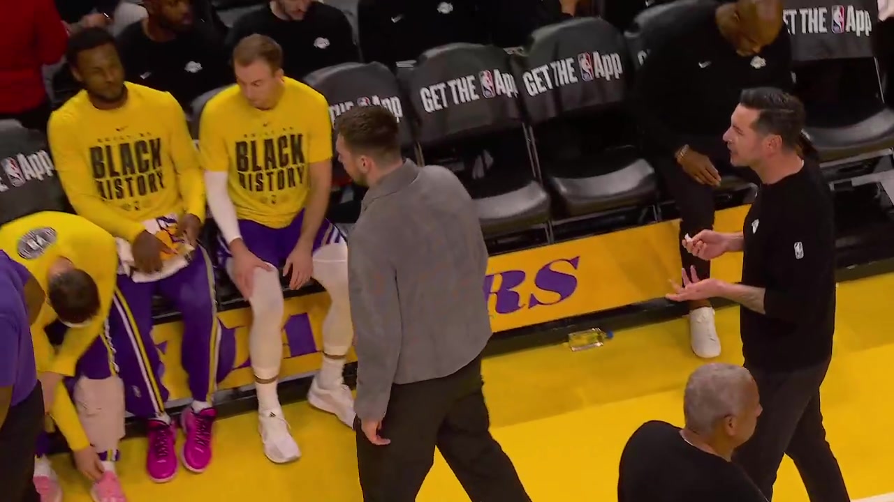 JJ Reddick coaching Luka Doncic on the sideline even though Luka is DNP tonight