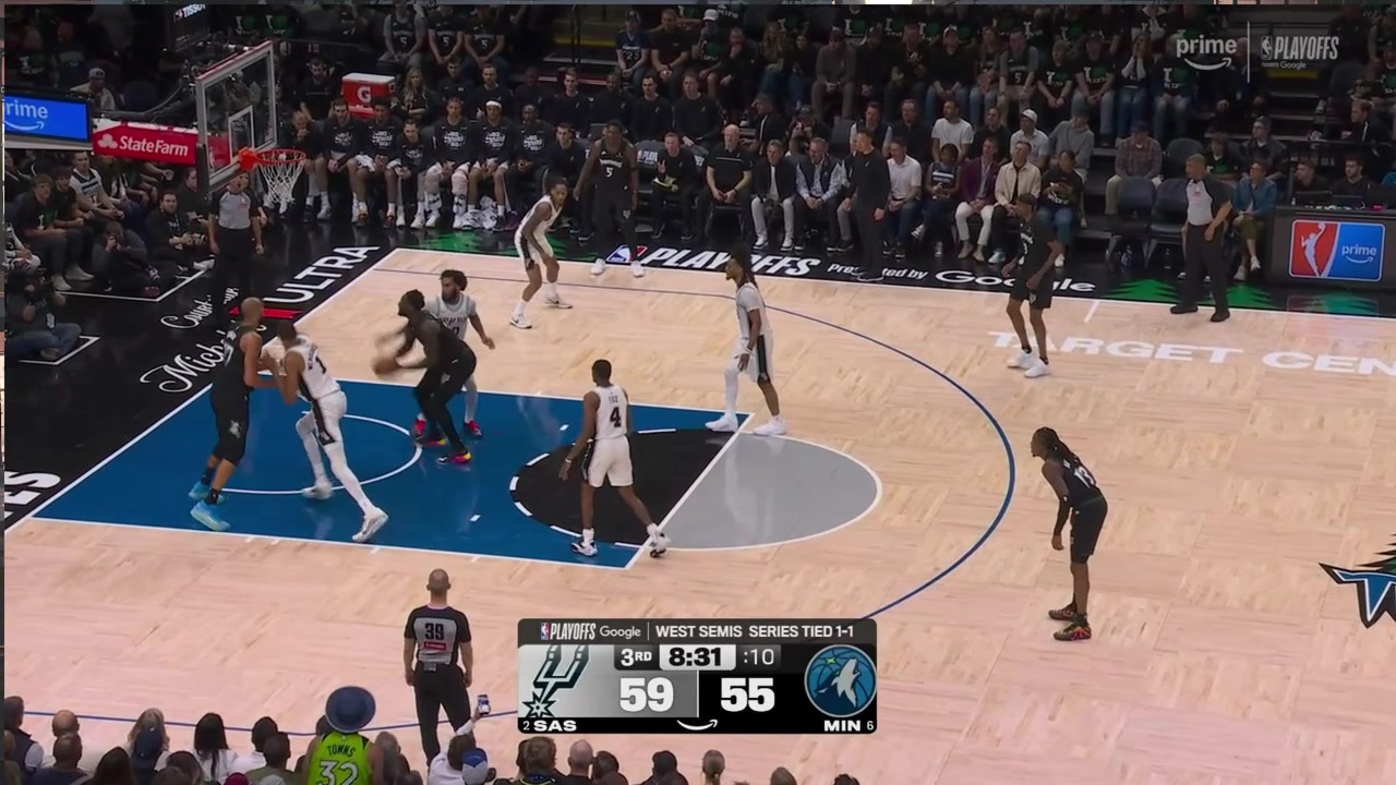 Victor Wembanyama gets pushed over fighting for a rebound