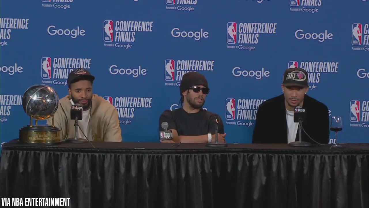 You're supposed to be asking questions and you went and got chicken wingsJosh Hart with his glass of wine talks to a reporter eating at the presser