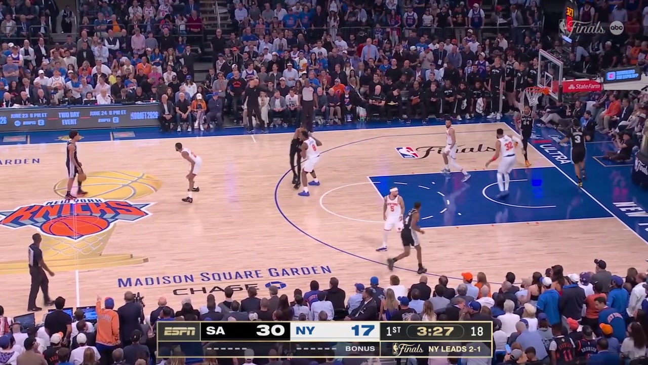Victor Wembanyama misses the layup with his right hand and tips it in with his left hand as the Knicks complain for a goaltending no callWith replays