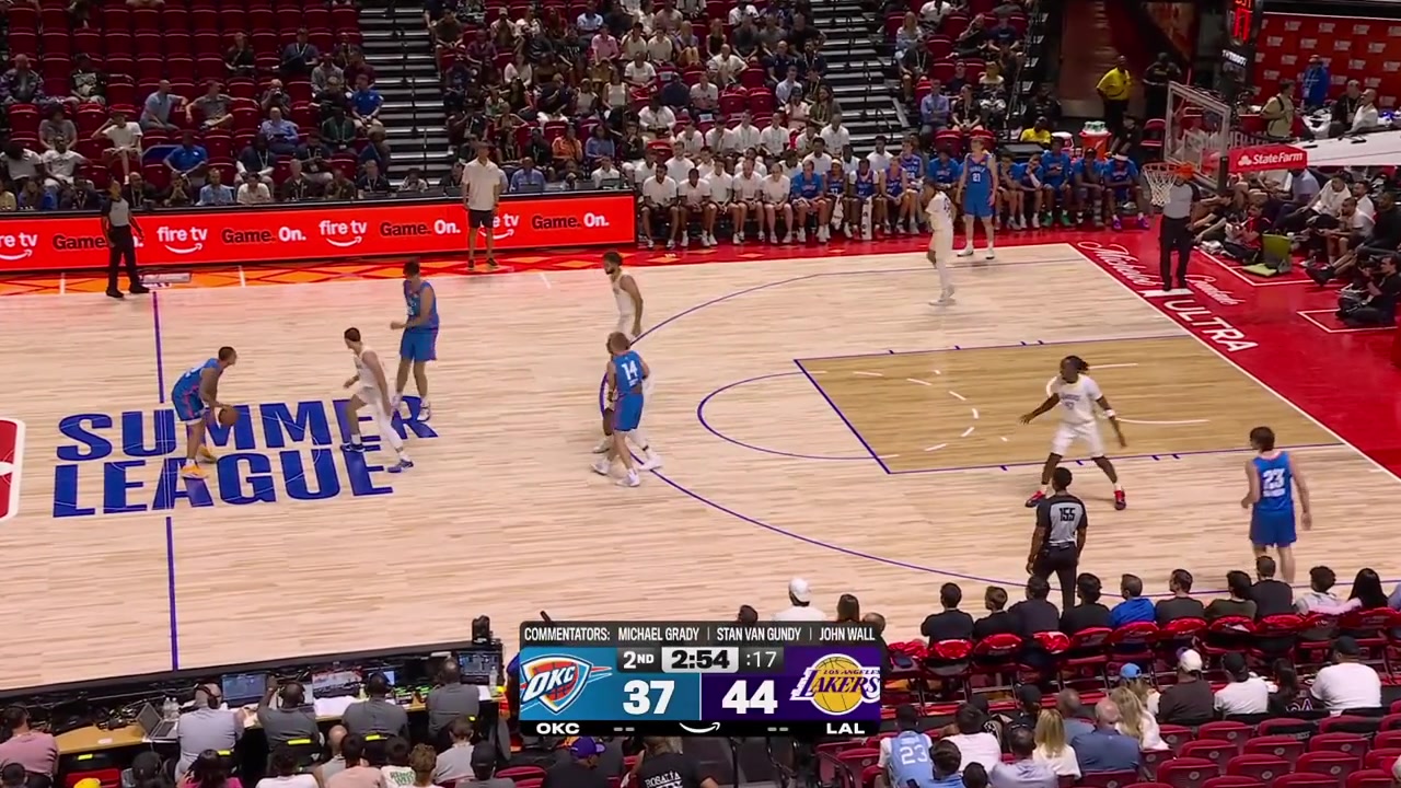 Adou Thiero with the powerful windmill dunk on the fastbreak as Chris Maon jumps for joy with many replays