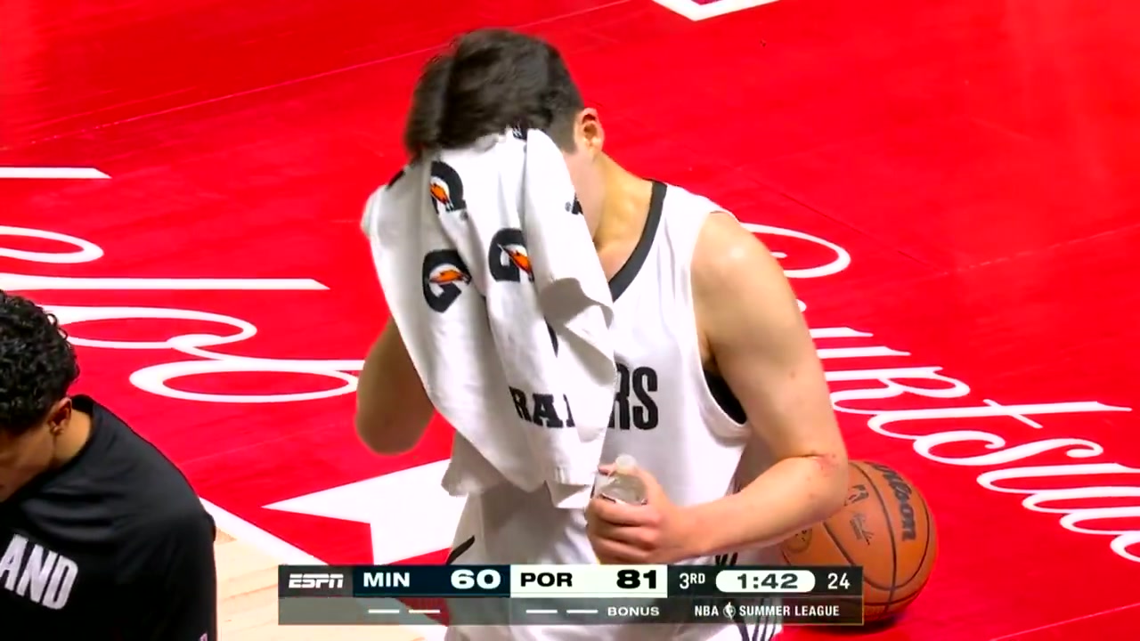 Yang Hansen with the rare miss - tries to drink from a bottle with the cap still on