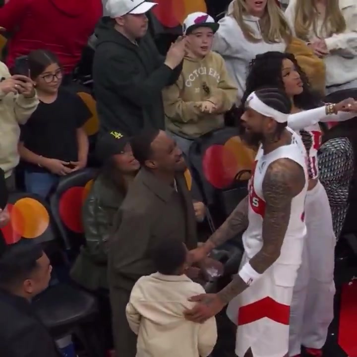 Brandon Ingram charges up his kid after a 21 point come-back win against the Magic