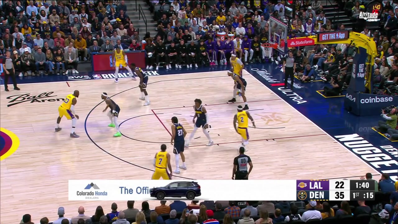 LeBron James gets by Bruce Brown but Peyton Watson's is there to block the shot