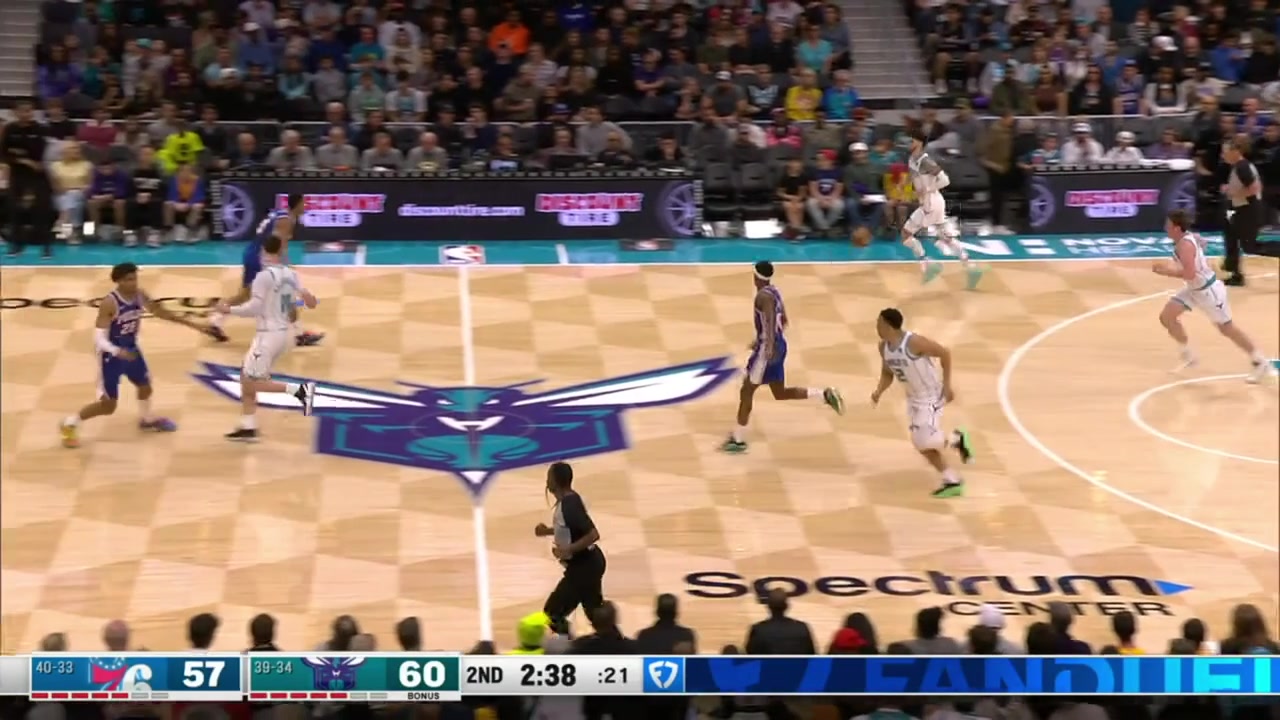 LaMelo Ball with the behind the back dribble the hop step to get under the rim the pump fake to make Joel Embiid jump and the lay up with a replay