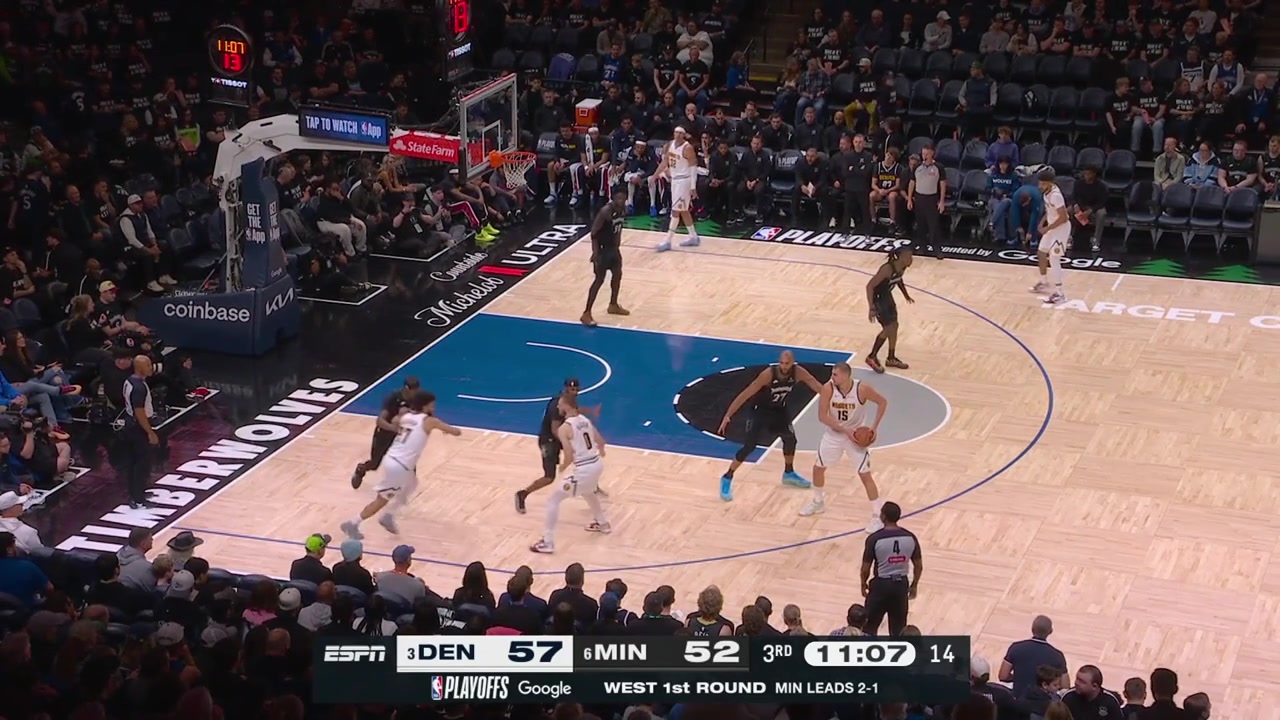Conley is called for the foul after he simultaneously shoves and trips Jokic prompting the stadium to boo and chant 'Refs you suck'