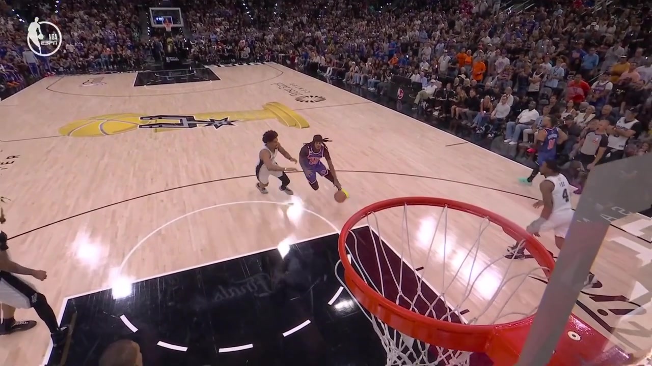 A replay of Dylan Harper blocks Jordan Clarkson from behind