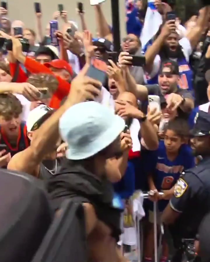 Josh Hart hopped off the float to embrace fans and take selfies with them