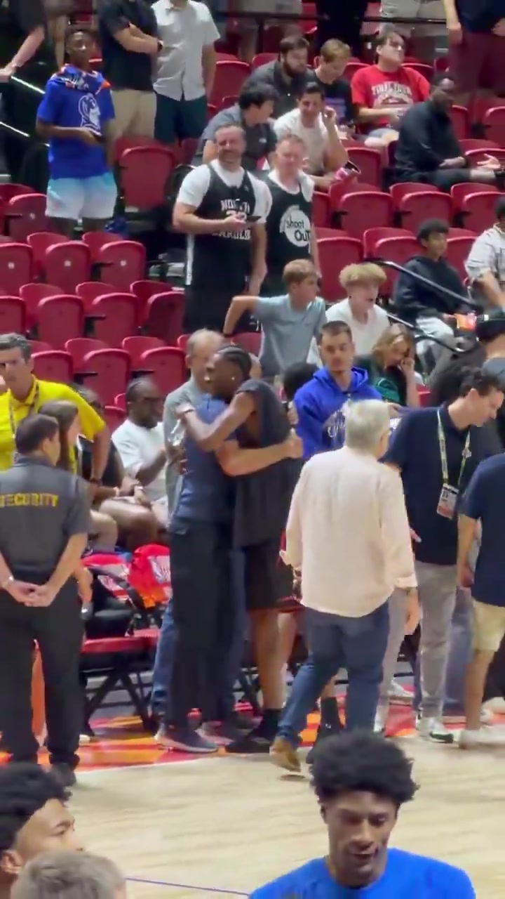 Rob Pelinka and Denver Nuggets restricted free agent Peyton Watson having a very friendly conversation during the Lakers Summer League game in Las Vegas