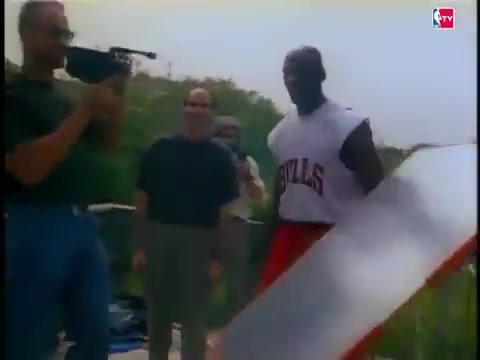 Michael Jordan casually throws a football 65 yards behind the scenes while filming an episode of NBA Inside Stuff with Ahmad Rashad 1992