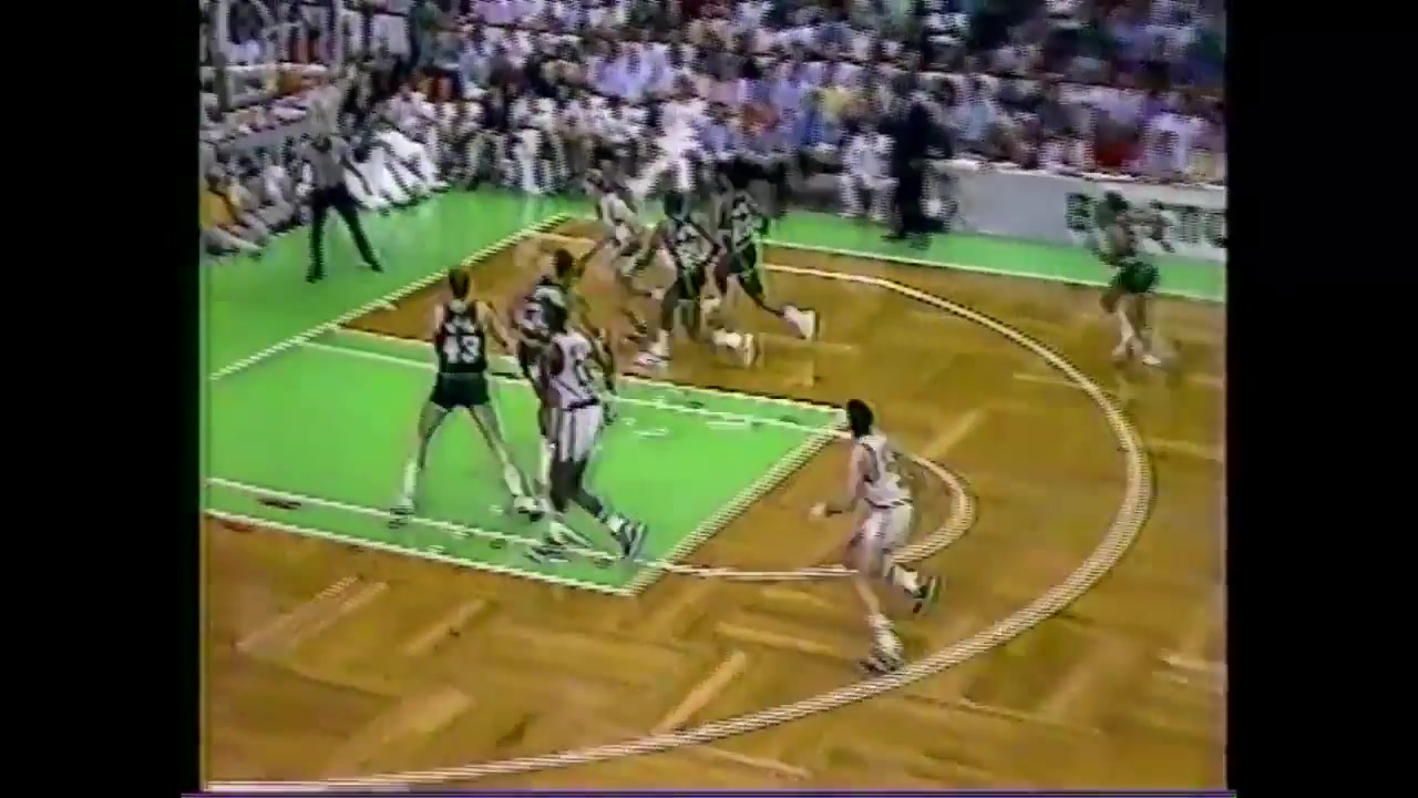 Larry Bird has verbals for the referee and drills the subsequent jumper over Jack Sikma