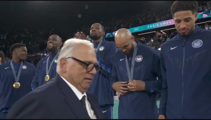 Tyrese Haliburton Jayson Tatum Joel Embiid Jrue Holiday Bam Adebayo Anthony Davis and Devin Booker receive their gold medals