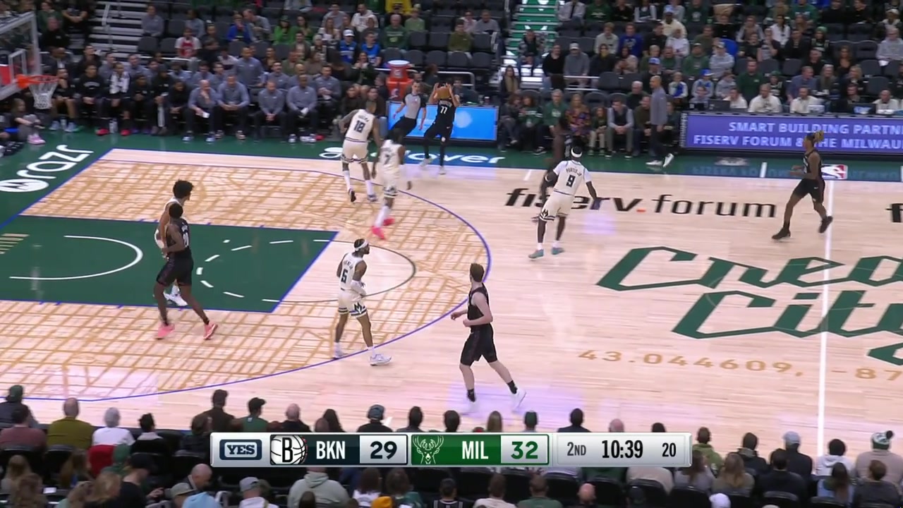 Ben Saraf drives to the rim plants his pivot in the restricted area while the other one is in the air does the fake pass and pump fake while off-balance and eventually somehow makes the tough shot over Kyle Kuzma with a replay