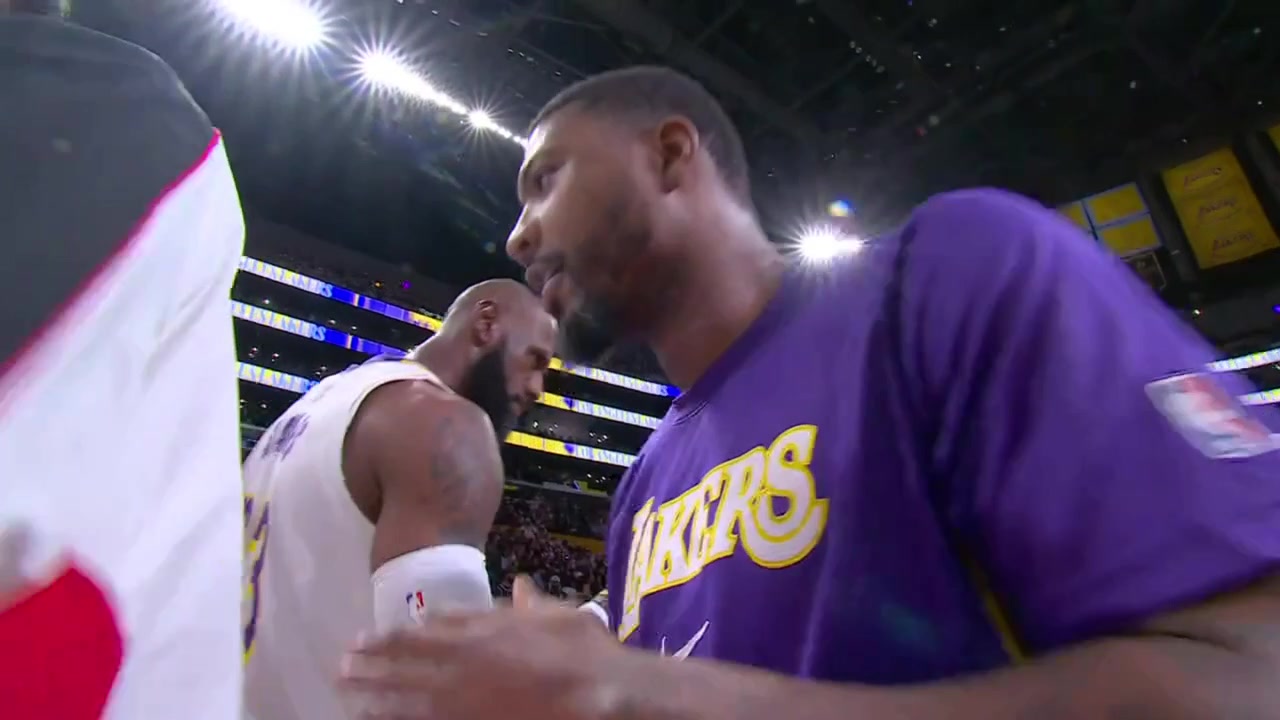 LeBron James throws some powder to the face of Rui Hachimura who does not enjoy it
