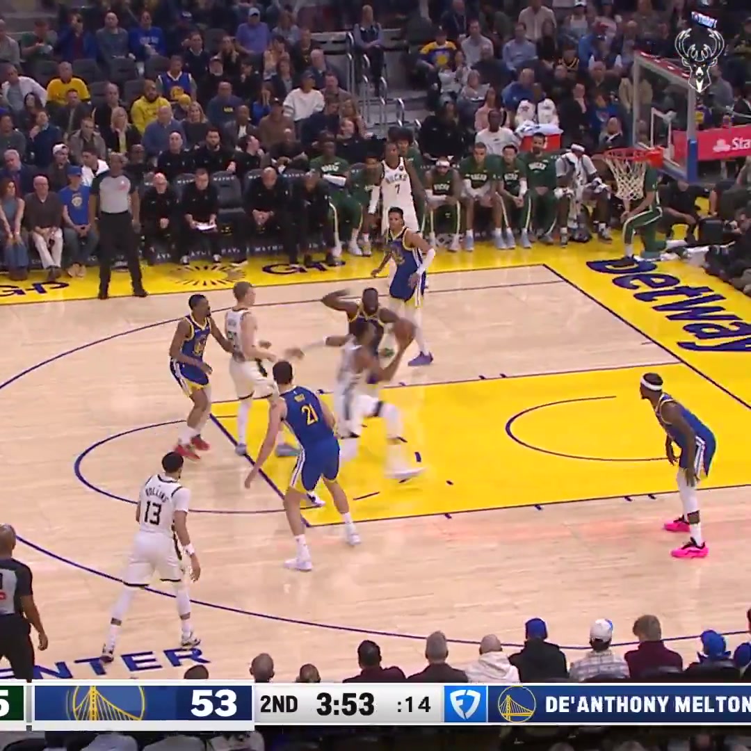 Giannis Antetokounmpo finishes through contact from Draymond Green