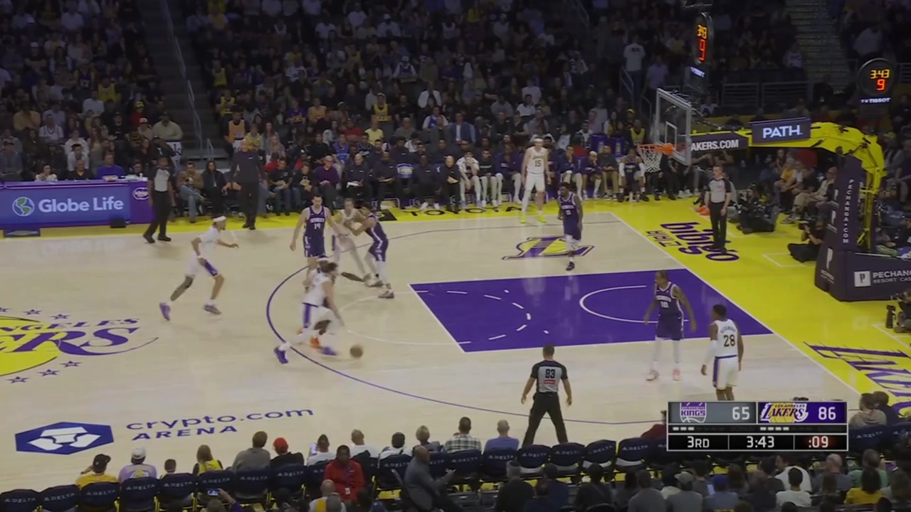 Doncic falls down keeps the dribble going then hits a 3 as he falls out of bounds with replay