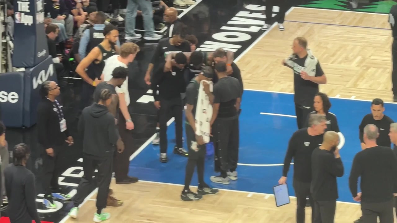 Anthony Edwards needs assistance to the locker room after falling down in significant pain and hurting his knee