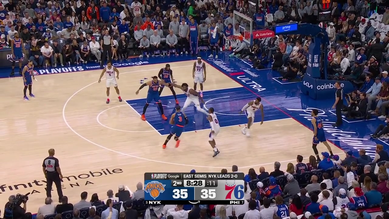 Joel Embiid grabs Karl-Anthony Towns' jersey Towns grabs Embiid's arm and Embiid takes down Towns with him with replaysIt was ruled a foul on Embiid but upon a coach's challenge it was overturned to a foul on Towns