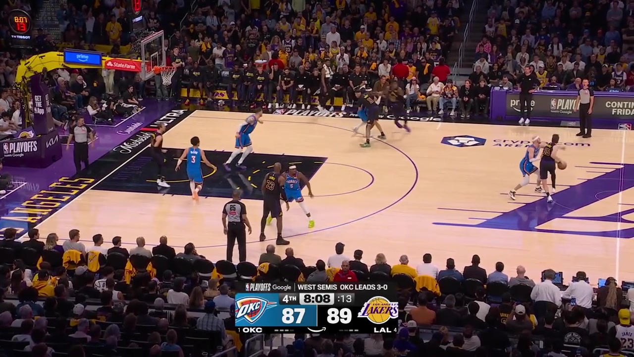 Austin Reaves hits the tough 3 to beat the shot clock while Alex Caruso is all over him with a replay