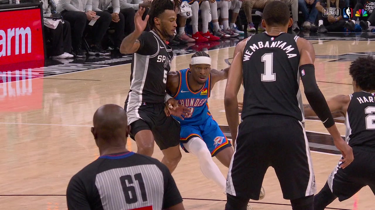 A replay of Shai Gilgeous-Alexander carefully looking about the whereabouts of Victor Wembanyama before deciding to hit the jumpr over Stephon Castle