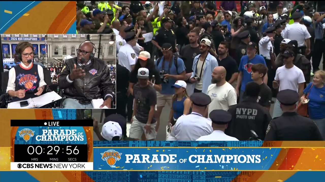 Landry Shamet arriving with Jeremy Sochan who is holding the Larry O'Brien Championship Trophy